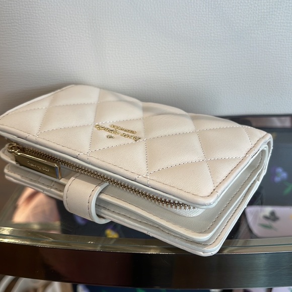 Kate Spade Carey Medium Compartment Bifold Wallet 
COLOR: Parchment - Picture 4 of 16